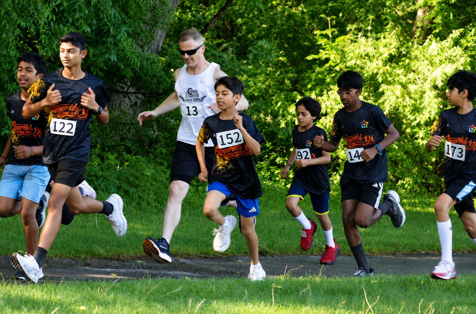 Kids running a 5K race in custom event t-shirts