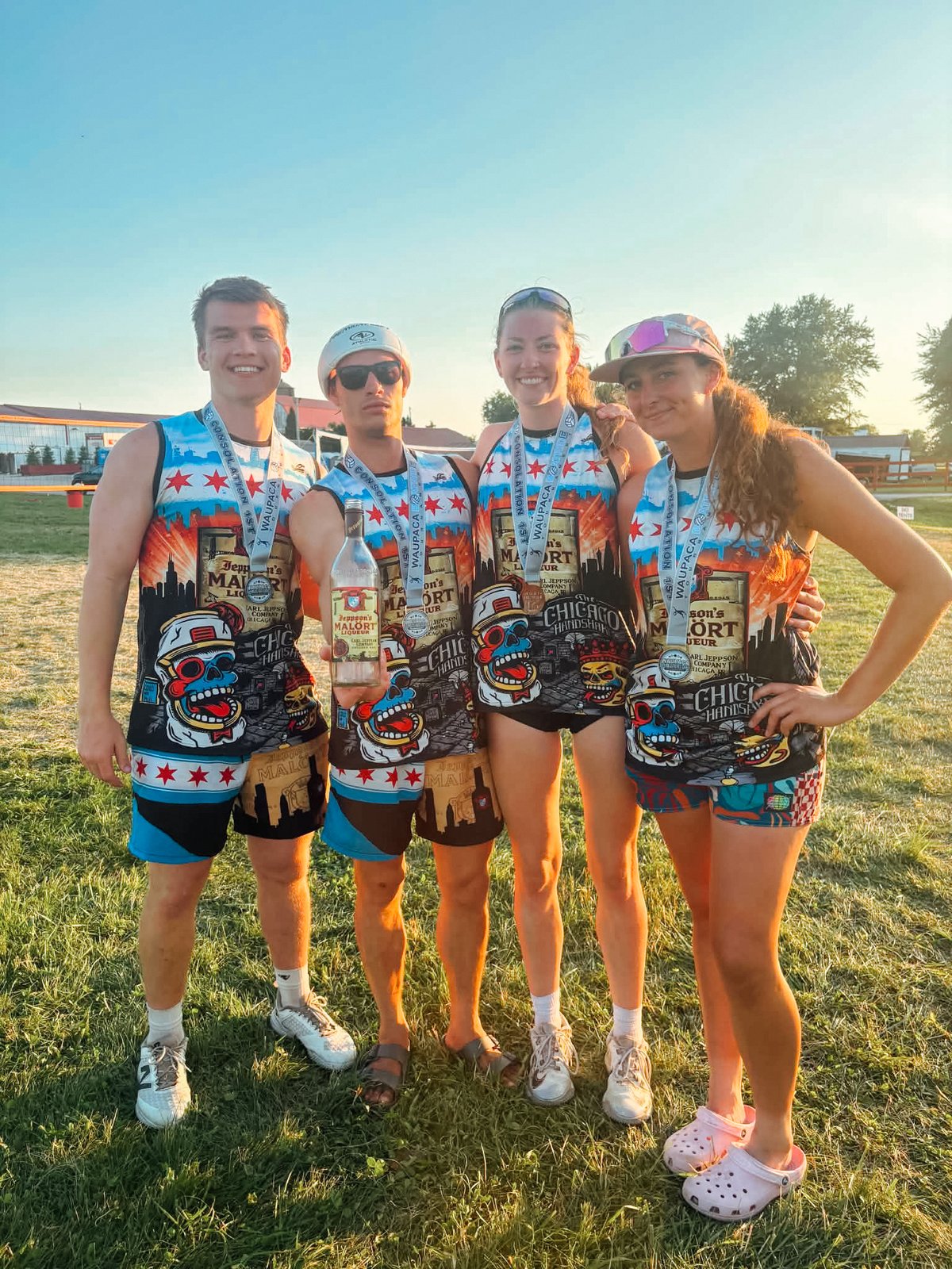 Tournament team wearing custom Chicago Malort jerseys with medals